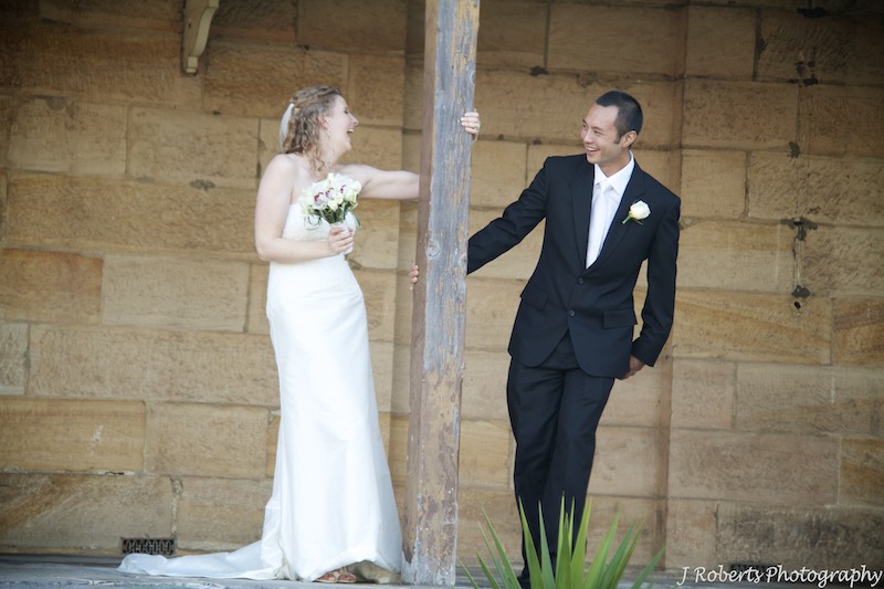 Couple swinging on verandah of heritage house - wedding photography sydney